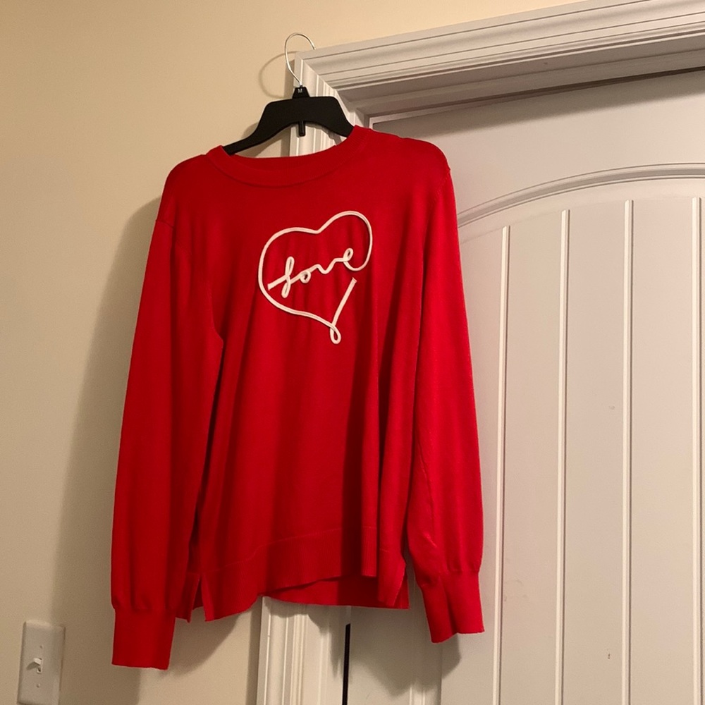 I don’t know the exact brand of the sweater
